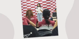 フィリピンのセブ島・リロアンにあるCIJ Academy & Schoolの2026年10月第3週Webzineの表紙で、教室の前方でマイクと用紙を持って話す女性と、着席して話を聞く講師たちの写真